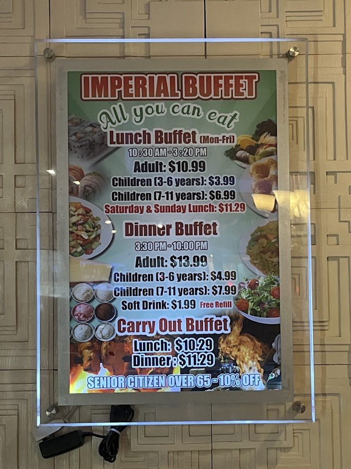 Buffet trays lined with Chinese dishes.